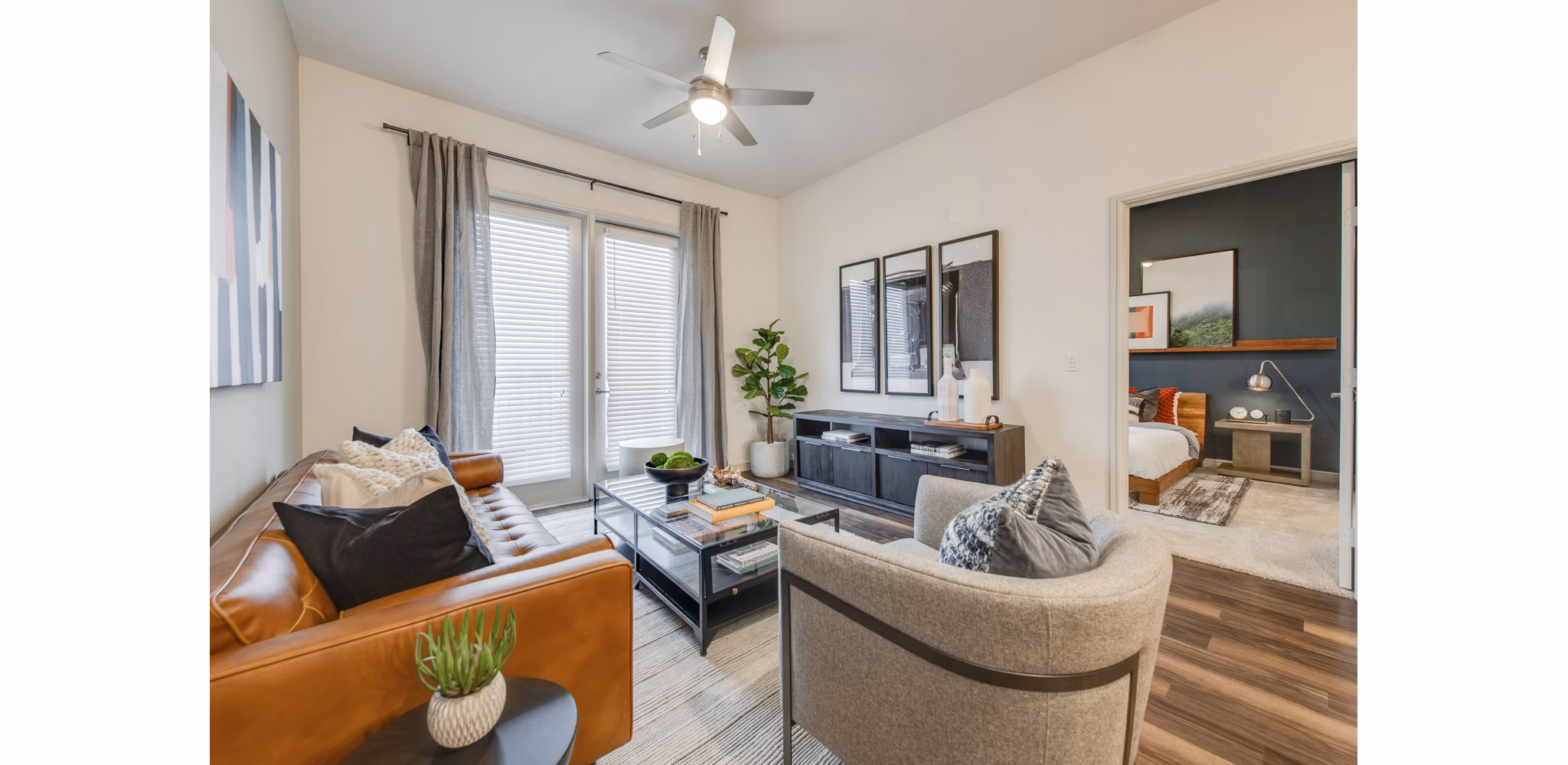 Modern living room with stylish furniture and natural light at The Silverlake Apartments