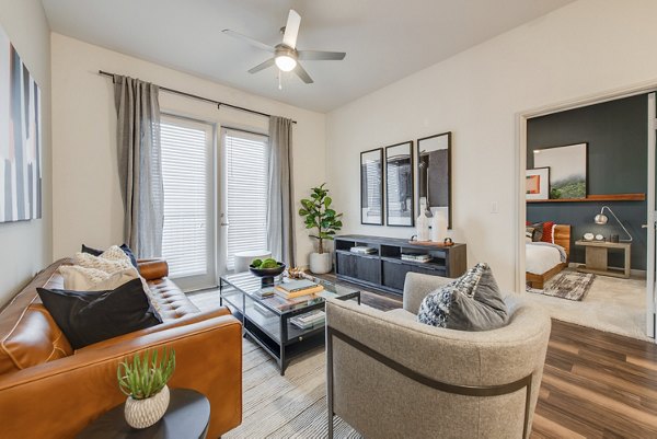 Modern living room with stylish furniture and natural light at The Silverlake Apartments