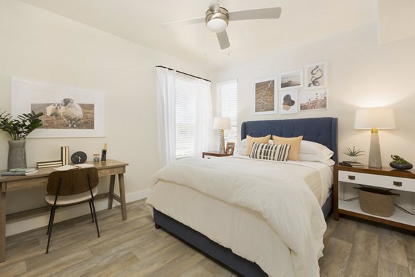 Modern bedroom with stylish decor at ORA Apartments, featuring luxury finishes and natural light