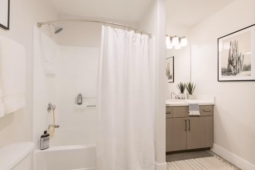 Elegant bathroom with marble countertops at ORA Apartments