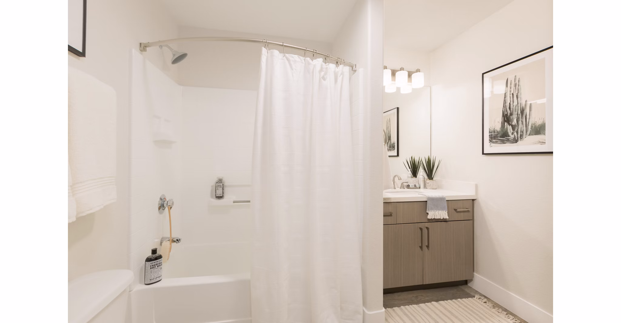 Elegant bathroom with marble countertops at ORA Apartments