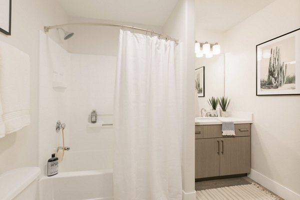 Elegant bathroom with marble countertops at ORA Apartments