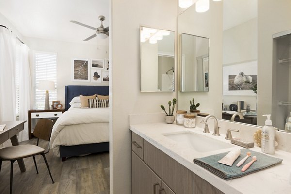 Bathroom featuring modern fixtures and sleek design at ORA Apartments