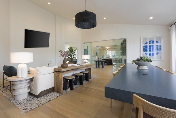 Clubhouse featuring modern design and stylish seating at ORA Apartments