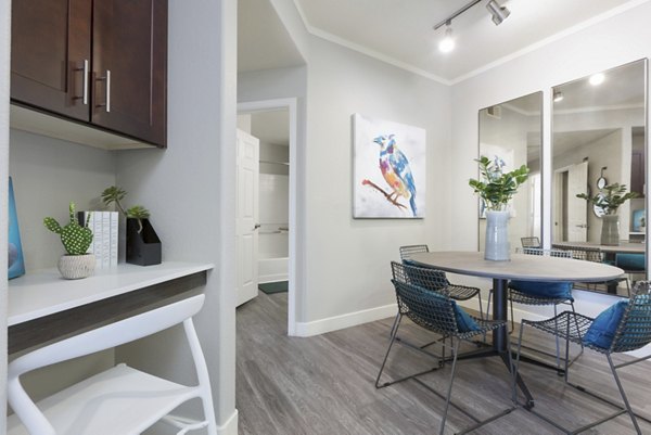 Modern kitchen with granite countertops and stainless steel appliances in ORA Apartments luxury residence