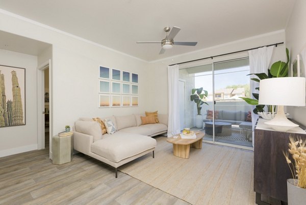 Spacious, modern living room with designer furnishings at ORA Apartments, luxury living by Greystar
