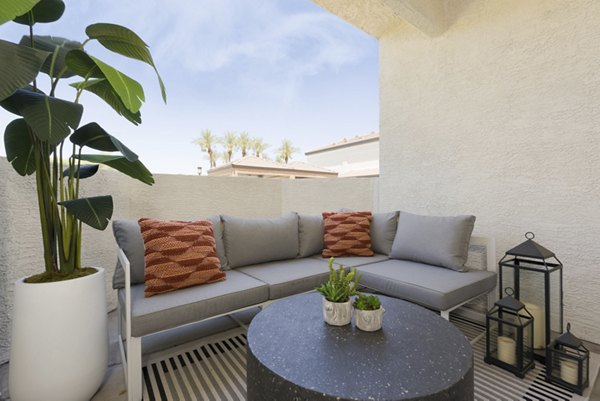 ORA Apartments: Modern patio with lounge seating and greenery, offering luxury outdoor living spaces