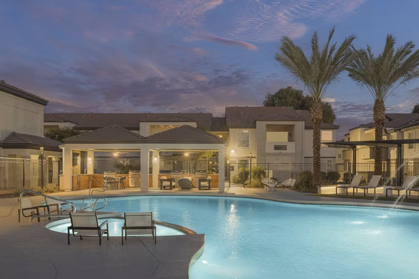 ORA Apartments: Luxurious pool with cabanas and palm trees