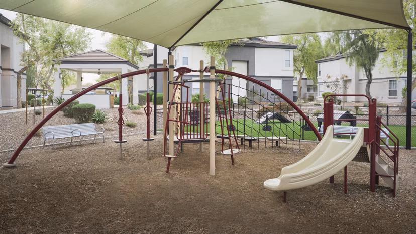 Modern playground with safe equipment at ORA Apartments, a luxury Greystar community perfect for families and kids' activities