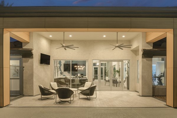 Cozy patio with stylish seating at ORA Apartments, showcasing modern luxury living outdoors