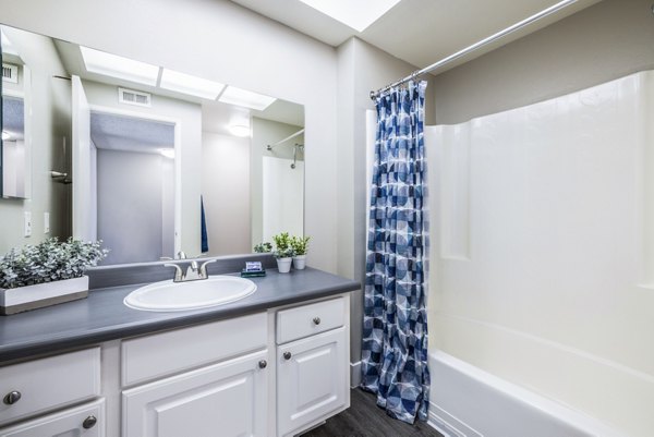 Bathroom featuring modern fixtures and elegant design at Lexington Townhomes Apartments