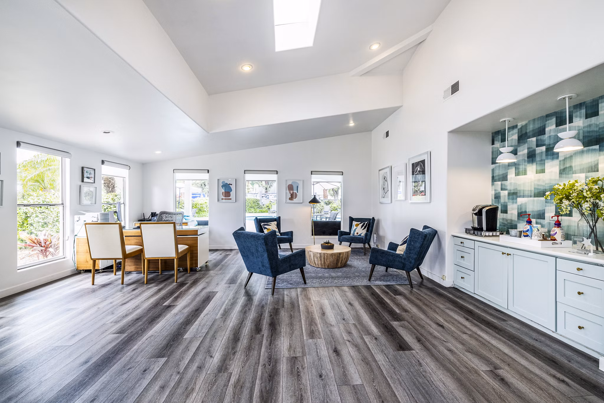 Clubhouse lobby featuring contemporary decor and seating at Lexington Townhomes Apartments