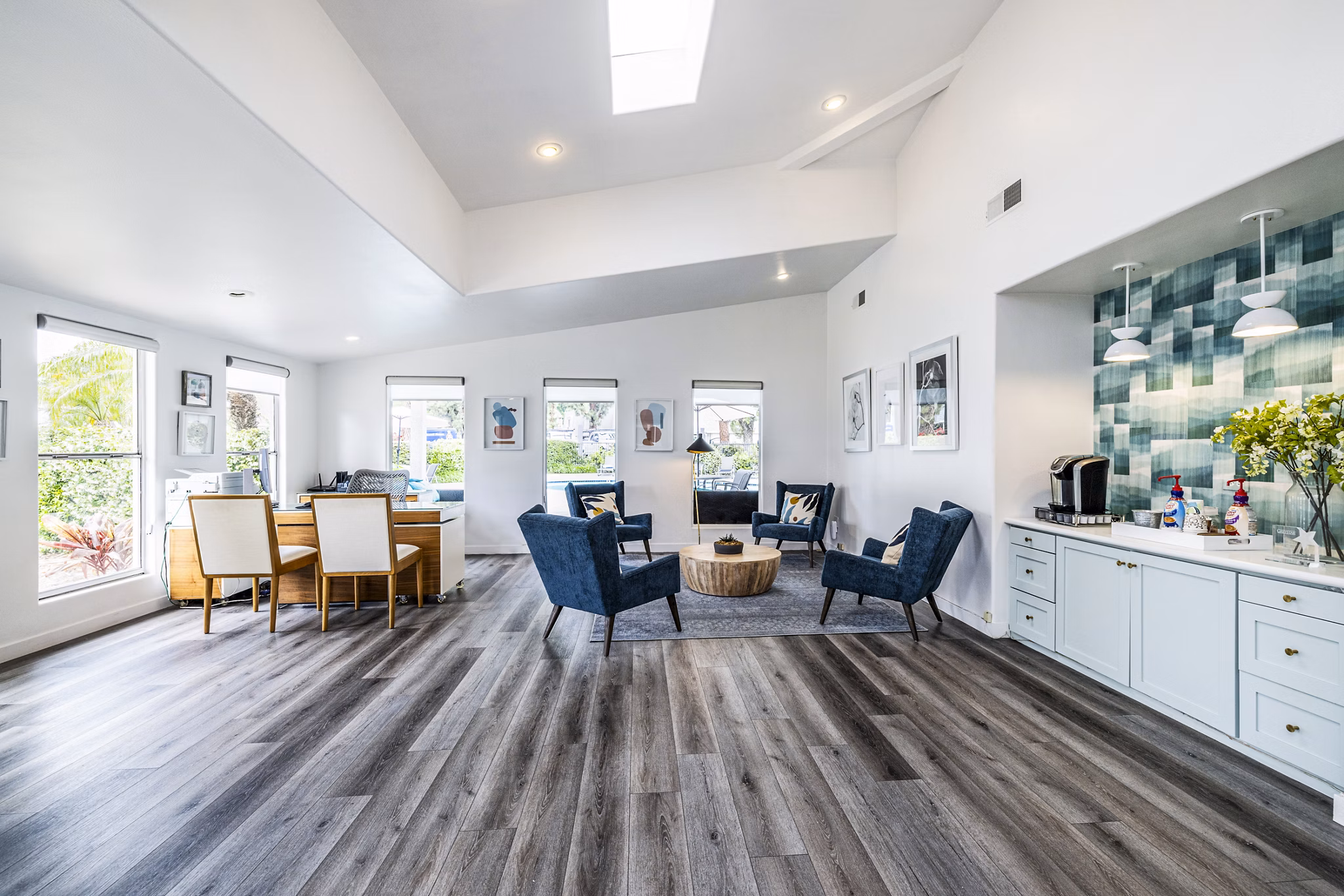 Clubhouse lobby featuring contemporary decor and seating at Lexington Townhomes Apartments