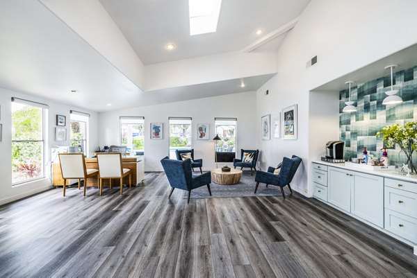 Clubhouse lobby featuring contemporary decor and seating at Lexington Townhomes Apartments