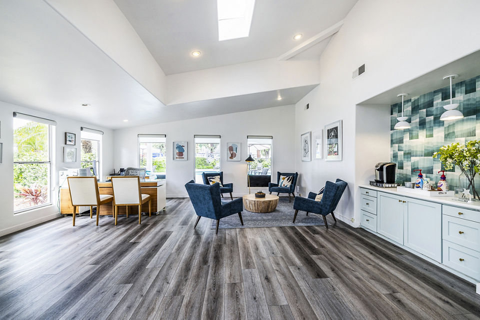 Clubhouse lobby featuring contemporary decor and seating at Lexington Townhomes Apartments