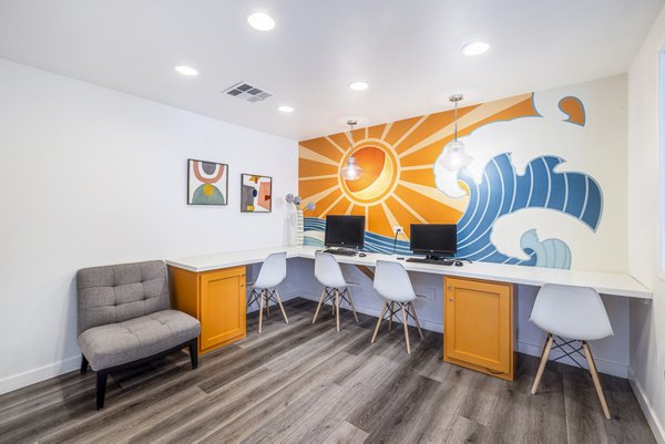 Clubhouse business center with modern workstations at Lexington Townhomes Apartments