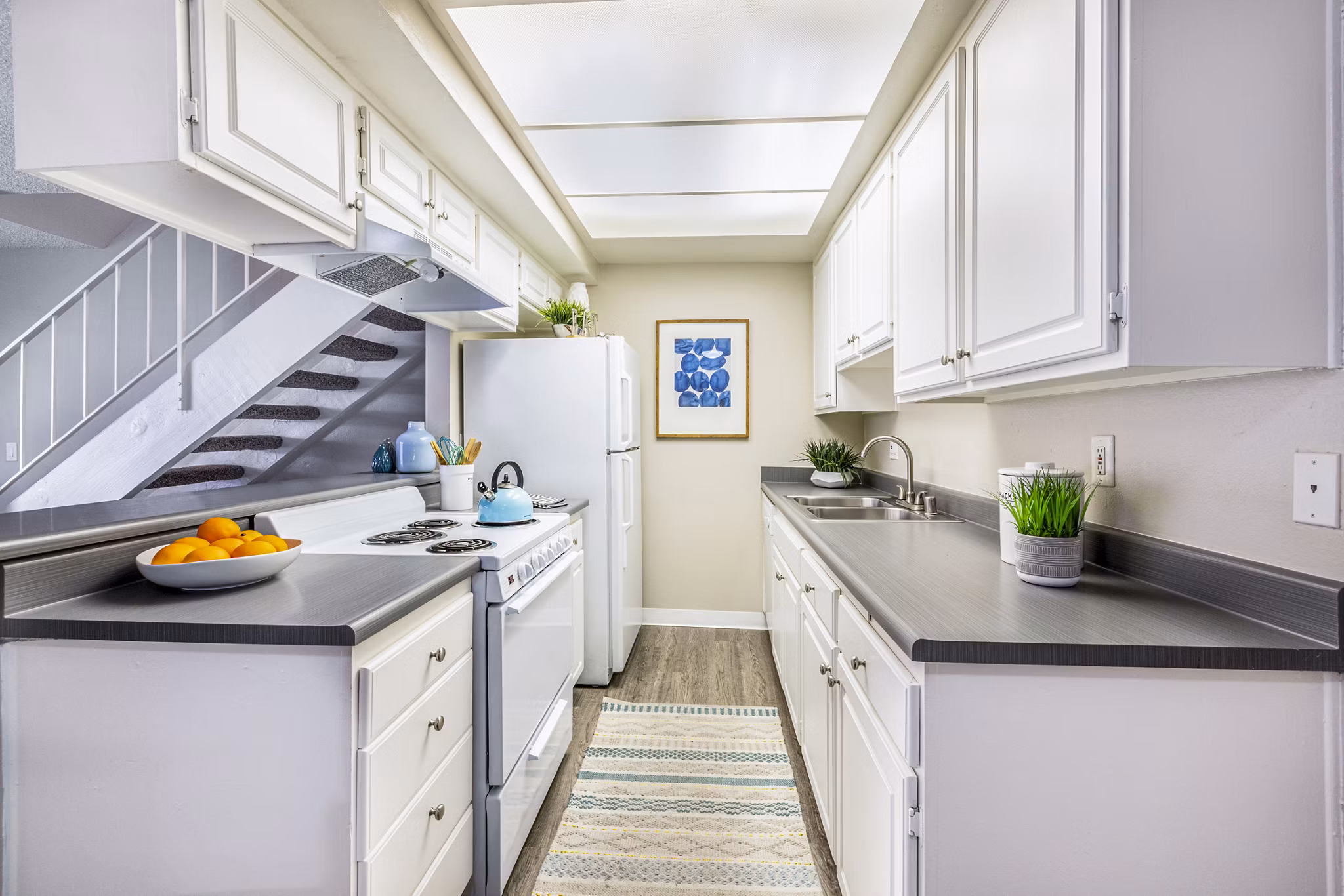 Modern kitchen with sleek appliances and granite countertops at Lexington Townhomes Apartments