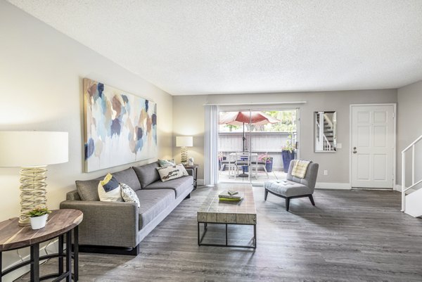 Spacious living room with modern decor at Lexington Townhomes Apartments
