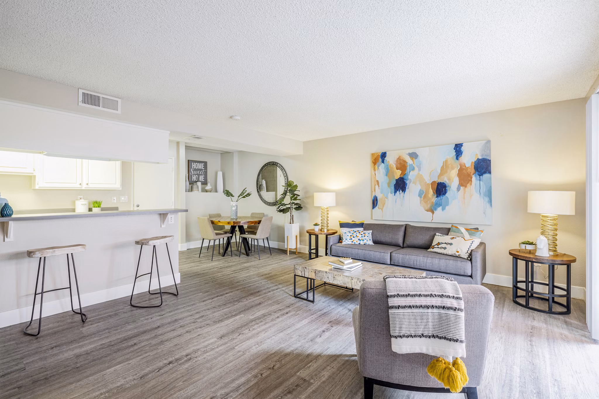 Living room featuring modern design and cozy seating in Lexington Townhomes Apartments, perfect for relaxation and entertainment