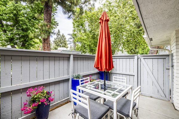 Patio with outdoor seating at Lexington Townhomes Apartments, luxury apartment community featuring stylish amenities and serene surroundings
