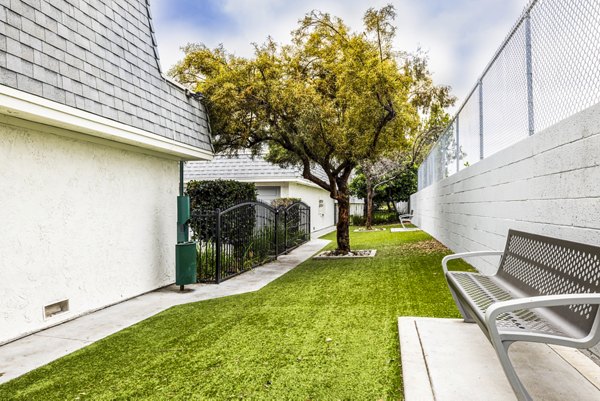 Dog park with agility course at Lexington Townhomes Apartments, ideal for pet-friendly living and leisure activities