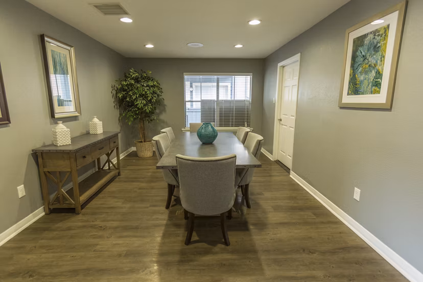 Meeting facility featuring modern conference tables and seating at Scotland Yard Apartments