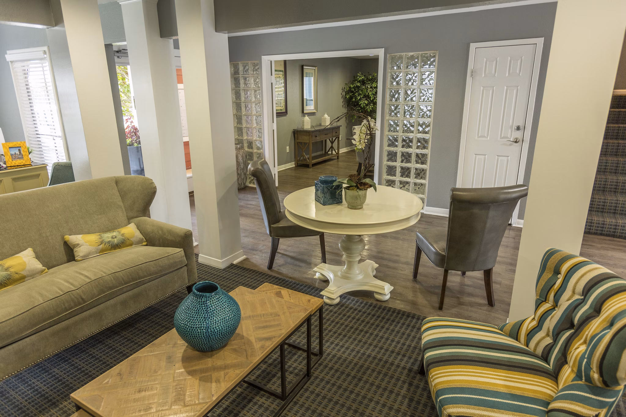 Clubhouse featuring modern decor and communal seating at Scotland Yard Apartments, a Greystar luxury apartment community