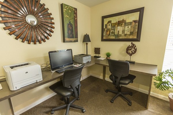 Business center with modern workstations at Scotland Yard Apartments