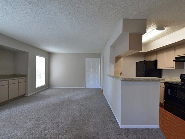 Living room featuring contemporary design and natural light at Scotland Yard Apartments luxury apartments