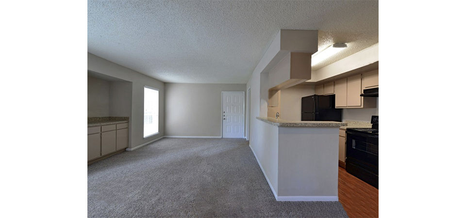 Living room featuring contemporary design and natural light at Scotland Yard Apartments luxury apartments