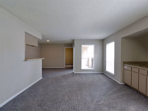 Living room with stylish decor and natural light at Scotland Yard Apartments