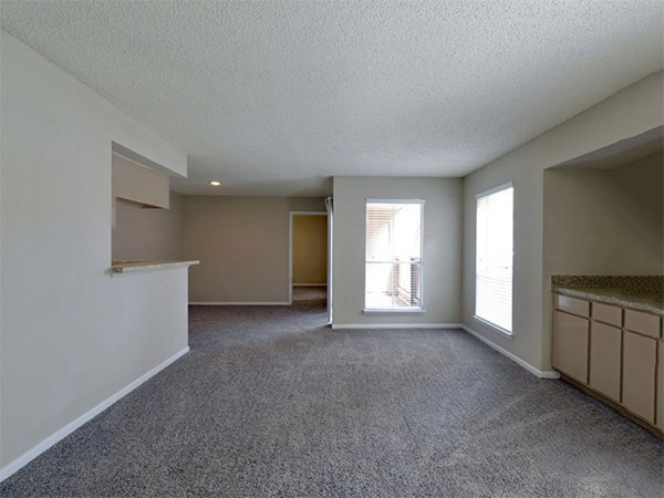 Living room with stylish decor and natural light at Scotland Yard Apartments