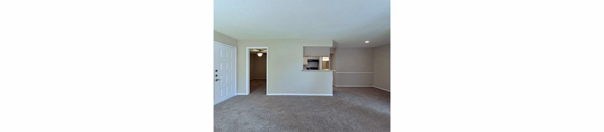 Spacious living room with modern furnishings at Scotland Yard Apartments