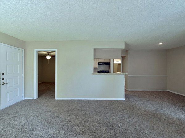 Spacious living room with modern furnishings at Scotland Yard Apartments