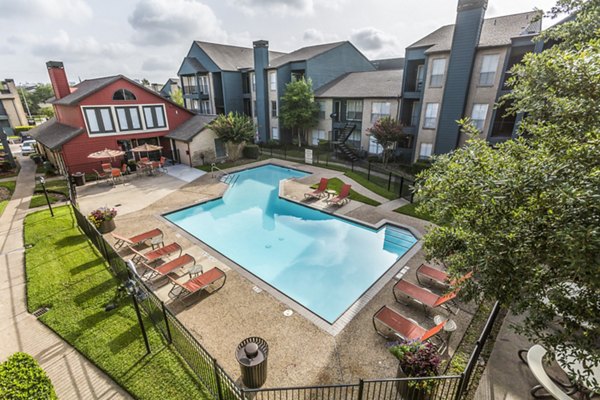 Resort-style pool at Scotland Yard Apartments offering luxury relaxation