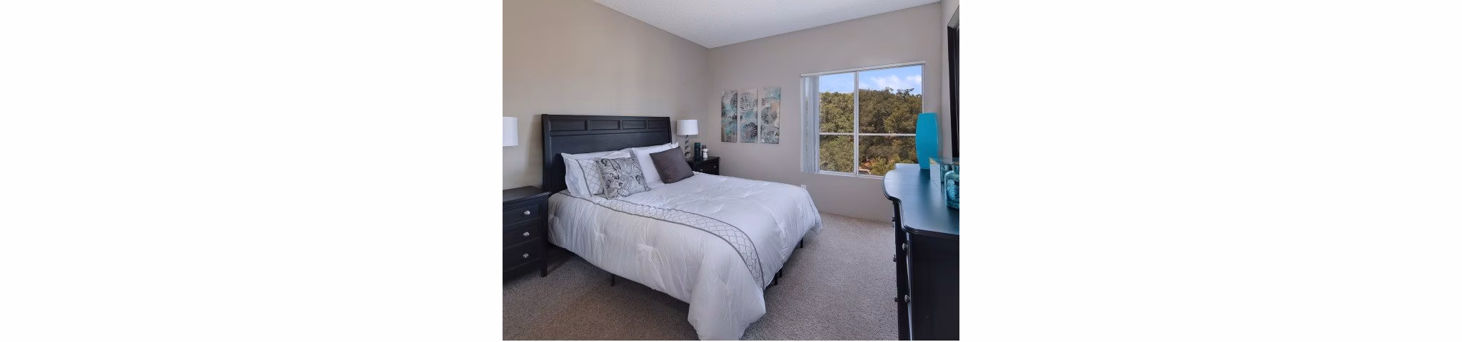 Cozy bedroom with elegant furnishings at Canyon Crest Apartments, Greystar luxury apartments in serene neighborhood
