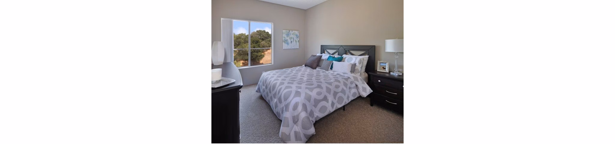 Bedroom with modern design and large windows at Canyon Crest Apartments offering luxury living spaces
