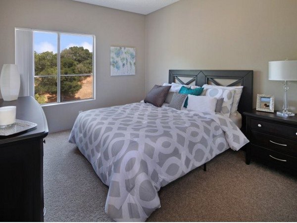 Bedroom with modern design and large windows at Canyon Crest Apartments offering luxury living spaces