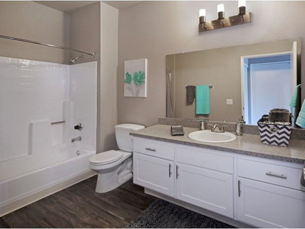 Elegant bathroom with granite countertops and modern fixtures at Canyon Crest Apartments