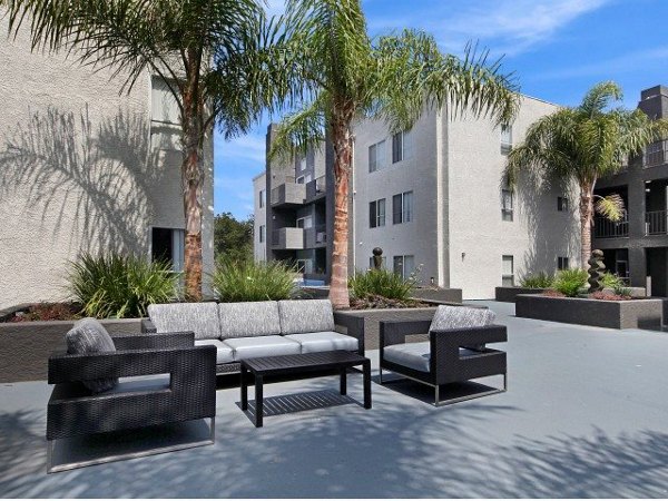 Canyon Crest Apartments: Tranquil courtyard featuring lush landscaping and seating areas for relaxation