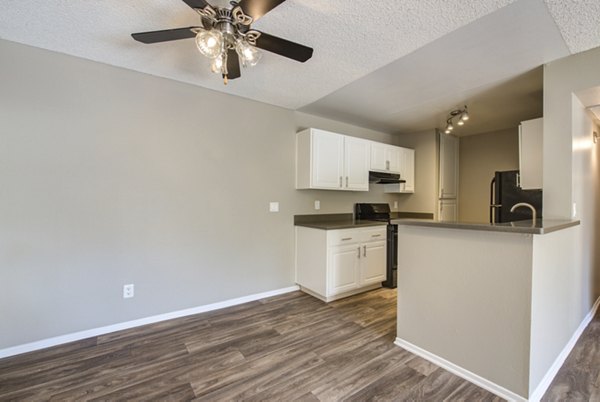 Dining area with modern furnishings at Canyon Ridge Apartments, a luxury rental community offering stylish living spaces