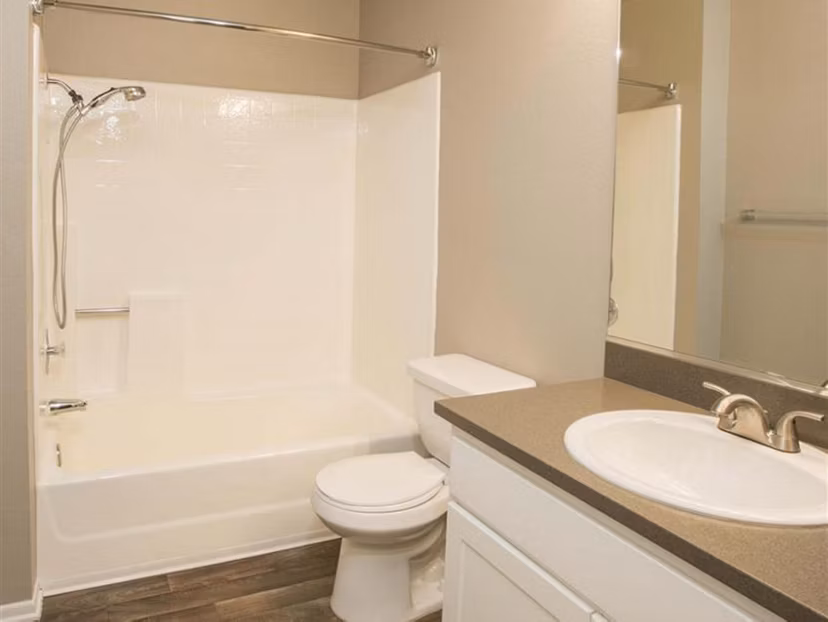 Bathroom with modern fixtures and marble countertop at Harborview Apartments in luxury community