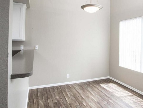 Dining area with modern furnishings at Harborview Apartments, offering a stylish space for residents to enjoy meals and entertain guests