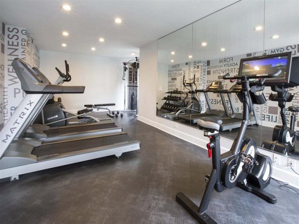 State-of-the-art fitness center with cardio and strength equipment at Harborview Apartments luxury living community