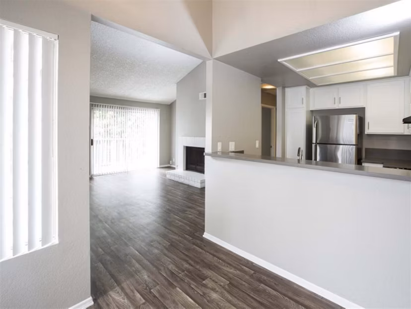 Cozy bedroom with stunning waterfront views at Harborview Apartments