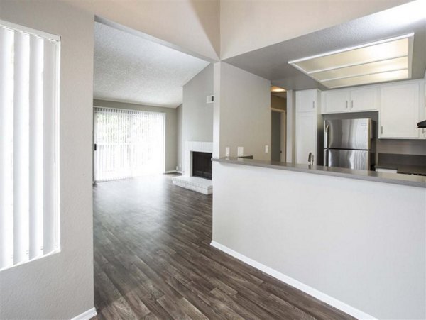 Cozy bedroom with stunning waterfront views at Harborview Apartments