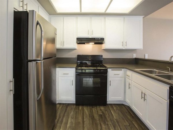 Modern kitchen with stainless steel appliances at Harborview Apartments, a Greystar luxury community