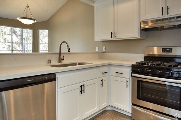 Modern kitchen with stainless steel appliances at Harborview Apartments