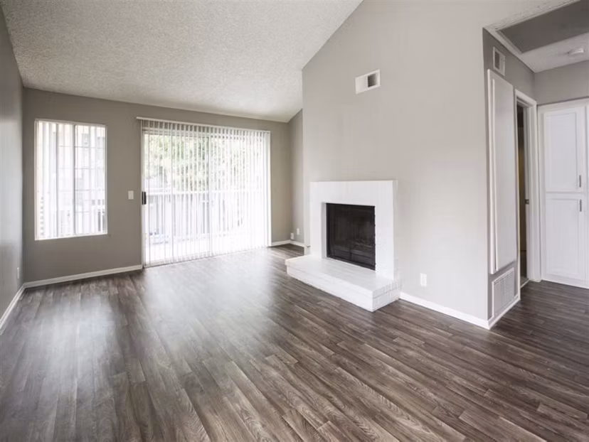 Spacious living room with waterfront views at Harborview Apartments, luxury Greystar property