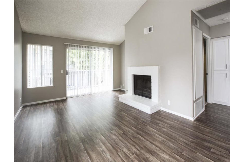 Spacious living room with waterfront views at Harborview Apartments, luxury Greystar property